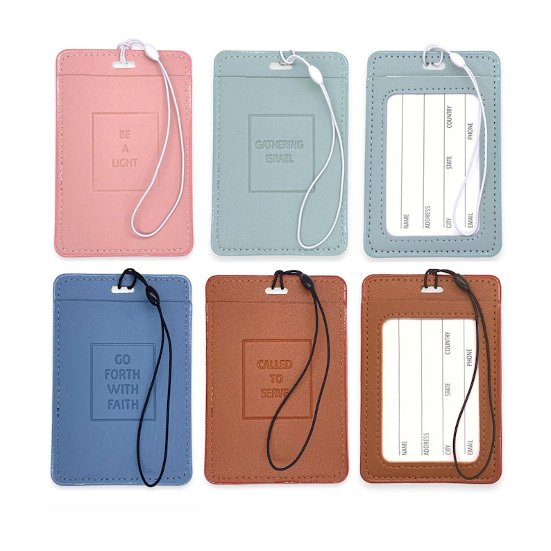 May include: Six different colored leather ID badge holders with a lanyard. The holders have different religious quotes on them, including "Be a Light", "Gathering Israel", "Go Forth With Faith", "Called to Serve", and two blank holders.