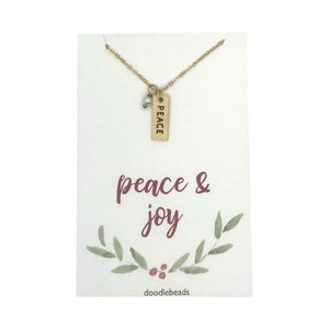 Collar con barra de la paz dorada, collar con la tarjeta "Paz y alegría", delicado collar con barra y detalle de perla, collar navideño para ella.
