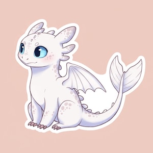 May include: A white cartoon dragon with large blue eyes, small wings, and a long tail. The dragon has small spots and is sitting on a light pink background. The dragon is a cute, friendly character.