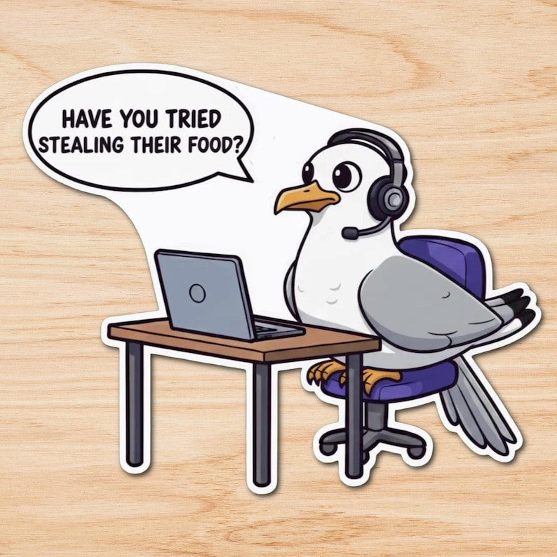 May include: A sticker featuring a cartoon seagull wearing a headset and sitting at a desk with a laptop. A speech bubble above the seagull reads, "HAVE YOU TRIED STEALING THEIR FOOD?" The seagull is white and gray with a yellow beak and is seated on a purple chair.