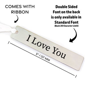 May include: A silver bookmark with the text "I Love You" engraved on it. The bookmark is 5 inches long and comes with a white ribbon.