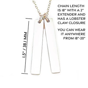 May include: A silver necklace with two rectangular pendants. The chain is 18 inches long with a 2 inch extender and a lobster claw closure. The necklace can be worn from 18 to 20 inches.