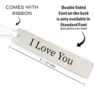 May include: A silver bookmark with the text "I Love You" engraved on it. The bookmark is 5 inches long and comes with a white ribbon.