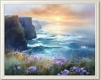 May include: A framed landscape painting depicts a coastal scene at sunset. Dark cliffs border the turquoise ocean, with waves crashing below a golden sky. Purple wildflowers and green grass are in the foreground, adding color to the serene artwork.