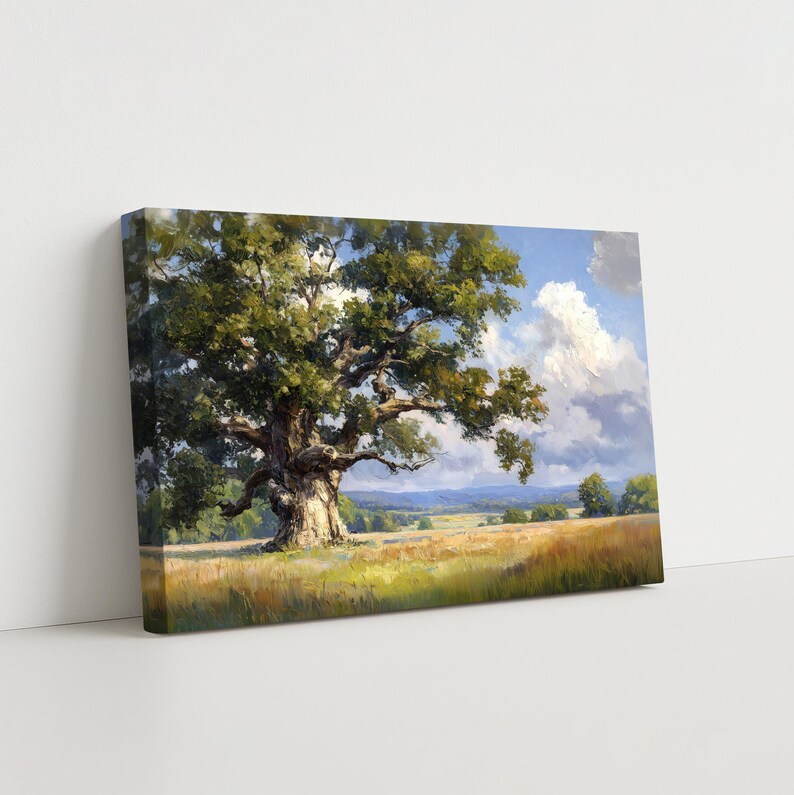 May include: A canvas print of a landscape painting depicting a large oak tree in a field. The tree has a thick trunk and green leaves. The background shows a blue sky with white clouds and rolling hills.