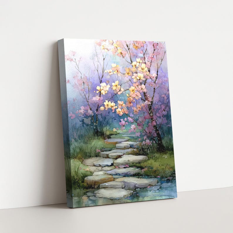 May include: A canvas print of a watercolor painting depicting a serene garden path. The path is made of stepping stones, leading through lush greenery and under flowering trees with pink and yellow blossoms. The background features a soft, purple and blue sky.