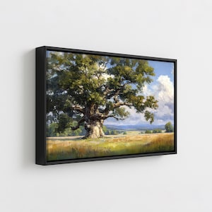 May include: A framed landscape painting shows a large oak tree in a field of golden grass. The tree's green leaves contrast with the blue sky and white clouds. The artwork is in a black frame.