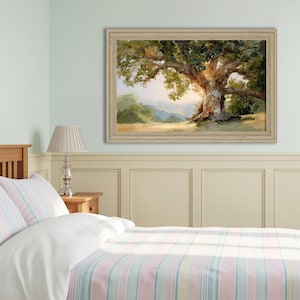May include: A framed landscape painting of a large oak tree with sprawling branches and lush green foliage. The artwork features a warm color palette with a focus on the tree's textured trunk and the surrounding landscape.