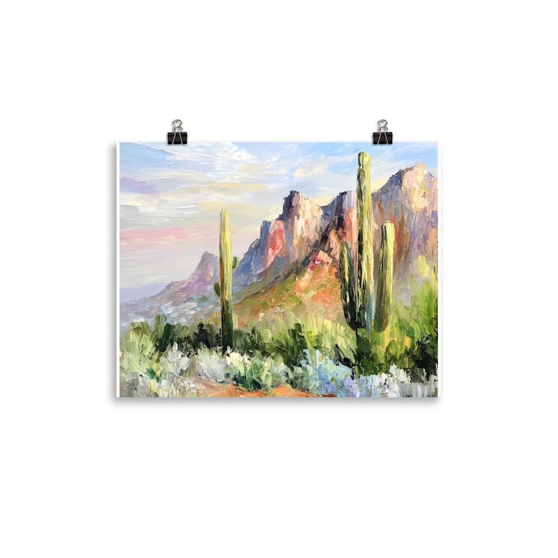 May include: An oil painting of a desert landscape featuring tall green cacti and rugged mountains under a cloudy sky. The artwork uses a palette of greens, blues, pinks, and oranges to depict the natural scenery.