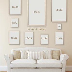 May include: A wall gallery featuring various sized picture frames in a living room setting. The frames are all gold in colour and have a white mount. The frames are arranged in a grid pattern on the wall. The frames are labelled with their dimensions in inches. The text "us sizes in inches" is written below the frames.
