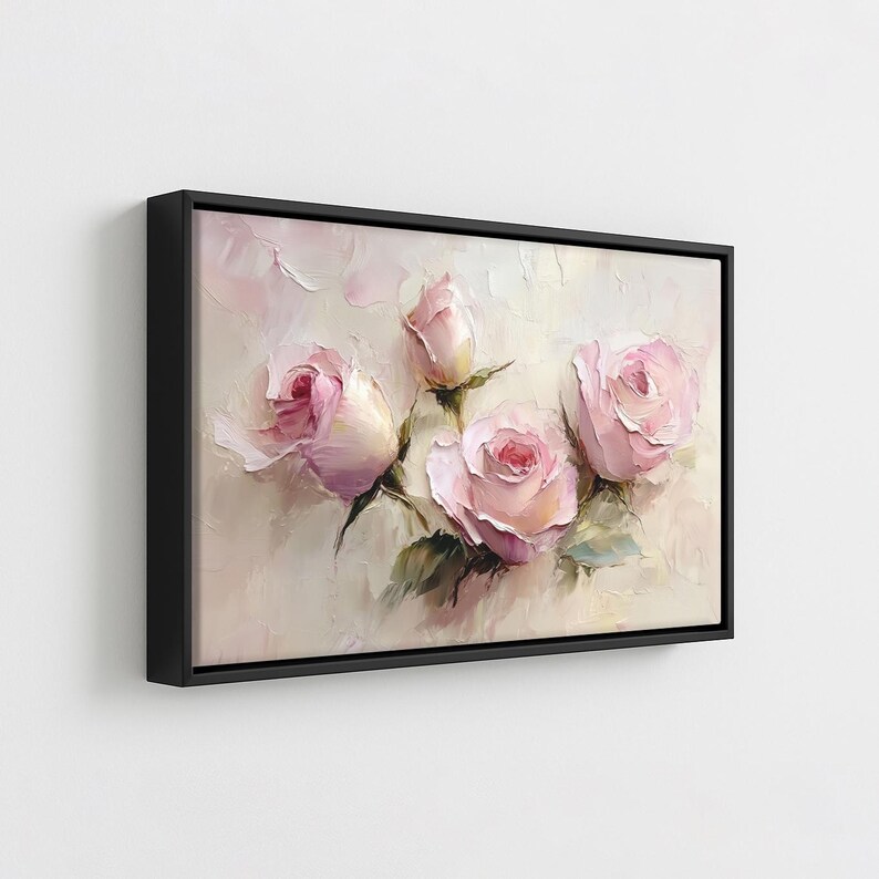 May include: A framed canvas art print featuring a floral still life. The artwork showcases pink roses and buds with green leaves against a soft, textured background. The painting is set in a black frame.