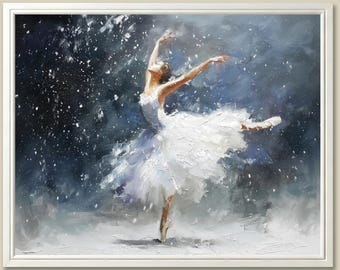 May include: Oil painting of a ballerina in a white tutu, en pointe, with arms gracefully extended. The background is a blend of blues and whites, suggesting a snowy scene. The artwork is framed in a white border.