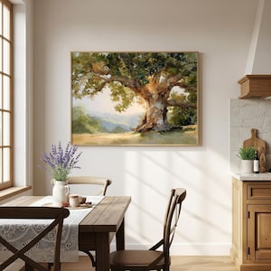 May include: A framed landscape painting of a large oak tree with lush green foliage and a thick, textured trunk. The artwork features a warm color palette with golden sunlight filtering through the branches. The painting is displayed above a wooden dining table.