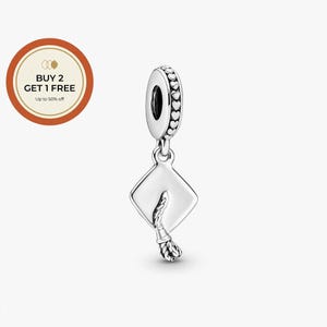May include: A silver graduation cap charm with a tassel. The charm has a heart-shaped design around the top. The image also includes a circular promotional graphic with the text "BUY 2 GET 1 FREE" and "Up to 50% off".