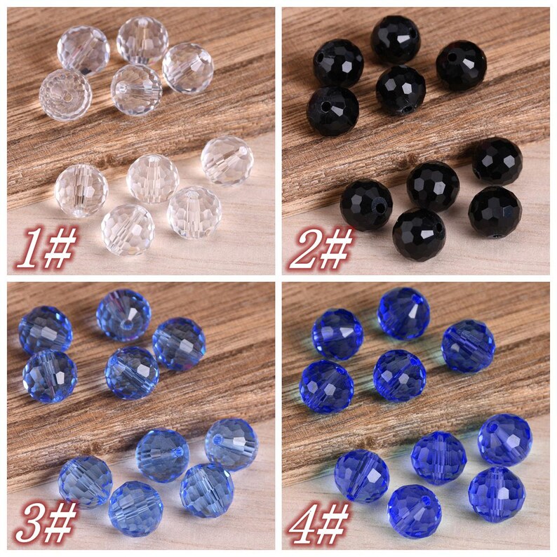 May include: Four sets of faceted glass beads in different colors. The first set is clear, the second is black, the third is light blue, and the fourth is dark blue.
