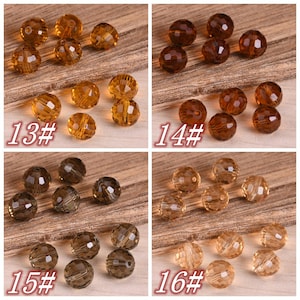 May include: Four sets of faceted glass beads in various shades of brown. Each set is labeled with a number, 13 through 16. The beads are arranged in a random pattern on a wooden surface.