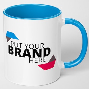 May include: White ceramic mug with a blue interior and handle. The mug has the text "PUT YOUR BRAND HERE" in black, with blue, grey, and red geometric shapes. A promotional item.