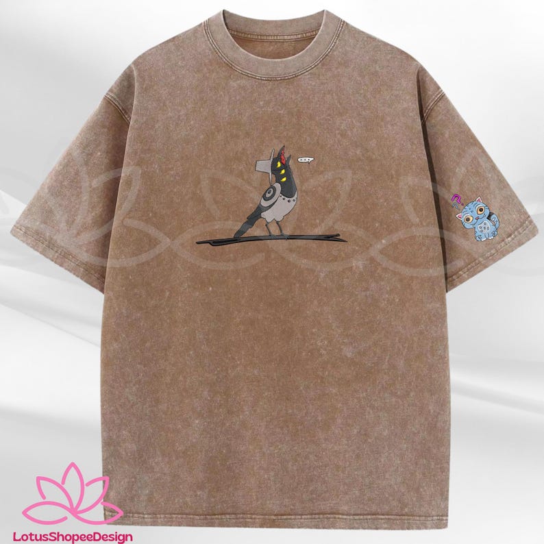 May include: Brown t-shirt with a distressed wash effect. The shirt features a cartoon bird graphic with a speech bubble and a blue owl on the sleeve. The bird is gray, black, and white. The owl is blue with a question mark.