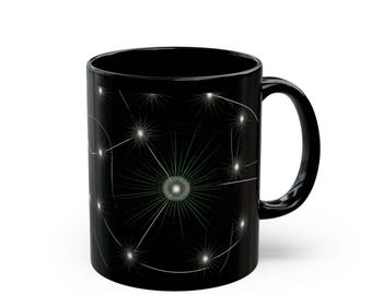 May include: Black ceramic mug featuring a white dandelion design. The dandelion has a green centre and white wispy seeds.