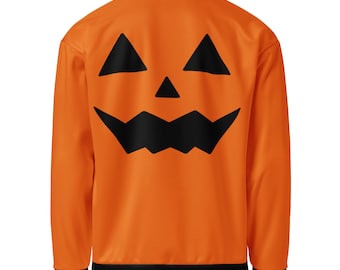 May include: Orange long-sleeved sweatshirt with a black jack-o'-lantern face design on the back. The sweatshirt has a black collar, cuffs, and hem. A festive Halloween-themed garment.