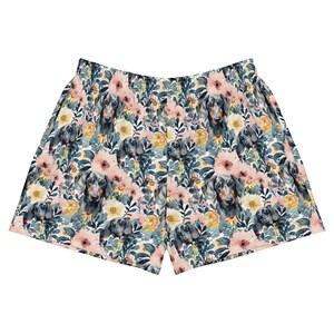 May include: White men's shorts with a floral print featuring a black and brown dachshund dog.