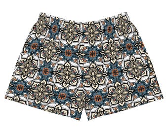 Può includere: Shorts blu e bianchi con motivo floreale. I pantaloncini hanno una fascia elastica comoda.