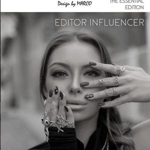 The image is a black and white photo of a woman with long hair wearing multiple rings on her fingers. She is holding her hand up to her face, obscuring her face. The image appears to be a collage of multiple images, and the text includes "SOHO FINDS", "URBAN COUTURE COLLECTION", "THE ESSENTIAL EDITION", "EDITOR INFLUENCER", "NEXT LEVEL", and "VOL2".