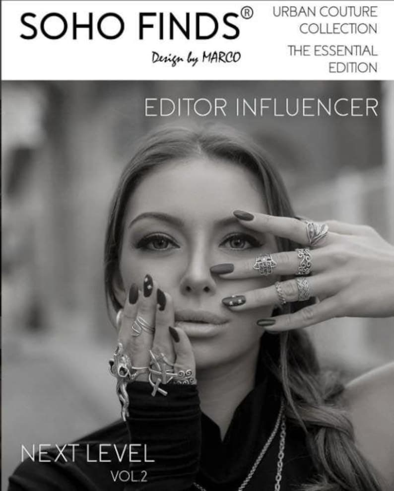The image is a black and white photo of a woman with long hair wearing multiple rings on her fingers. She is holding her hand up to her face, obscuring her face. The image appears to be a collage of multiple images, and the text includes "SOHO FINDS", "URBAN COUTURE COLLECTION", "THE ESSENTIAL EDITION", "EDITOR INFLUENCER", "NEXT LEVEL", and "VOL2".