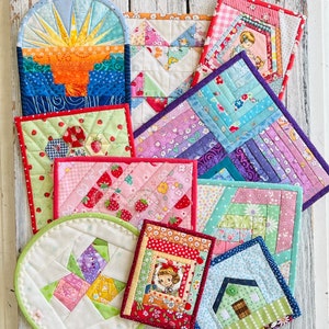 May include: A set of 10 colourful quilted pot holders with various patterns and designs. The pot holders feature a variety of fabrics, including floral prints, geometric patterns, and solid colours. The pot holders are perfect for protecting your hands from hot dishes and adding a touch of style to your kitchen.