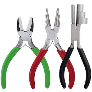 May include: Three metal jewellery pliers with coloured handles. The pliers include green, red, and black handles. The pliers have different head shapes for various jewellery-making tasks. The pliers are set against a white background.