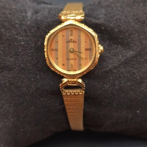 Vintage Itraco Quartz Watch: Gold-Tone Wood-Style Dial, Swiss Made