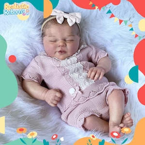 This 17&quot; (43.18 cm) realistic reborn doll is an inexpensive, full-body silicone newborn girl with dark hair.