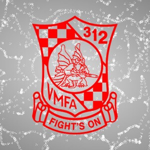 May include: Red and white checkered shield with a dragon holding a weapon, the text "VMFA 312" and "FIGHT'S ON" in a red banner.