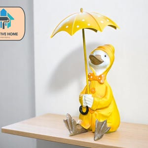 Estatua de resina de pareja de patos con paraguas, figura decorativa para jardín o patio, adorno para exteriores, escultura para patio o balcón.