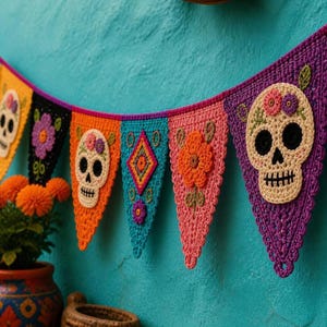 May include: A colorful crochet bunting banner featuring triangular flags with various designs, including cream-colored skulls with floral accents, a diamond shape, and orange flowers, all connected by a vibrant purple crocheted string.