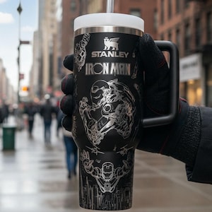 May include: A set of three ceramic mugs with a speckled, matte finish. Each mug is a different colour: light blue, cream, and grey. The mugs have a simple, modern design and a comfortable handle.