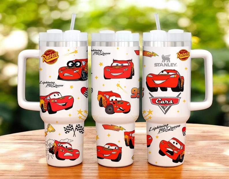 May include: Three white insulated tumblers with Lightning McQueen graphics. Each tumbler features a white handle, a white lid, and a straw. The tumblers are decorated with images of the red race car, stars, and the words "Lightning McQueen" and "Cars".