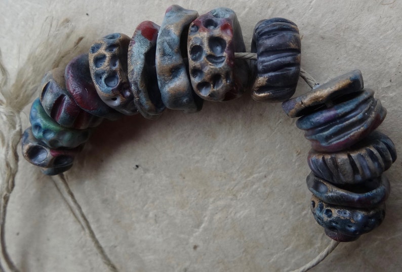early Summer dusk textured ceramic disc bead set purple red blue red gold katy wroe K44