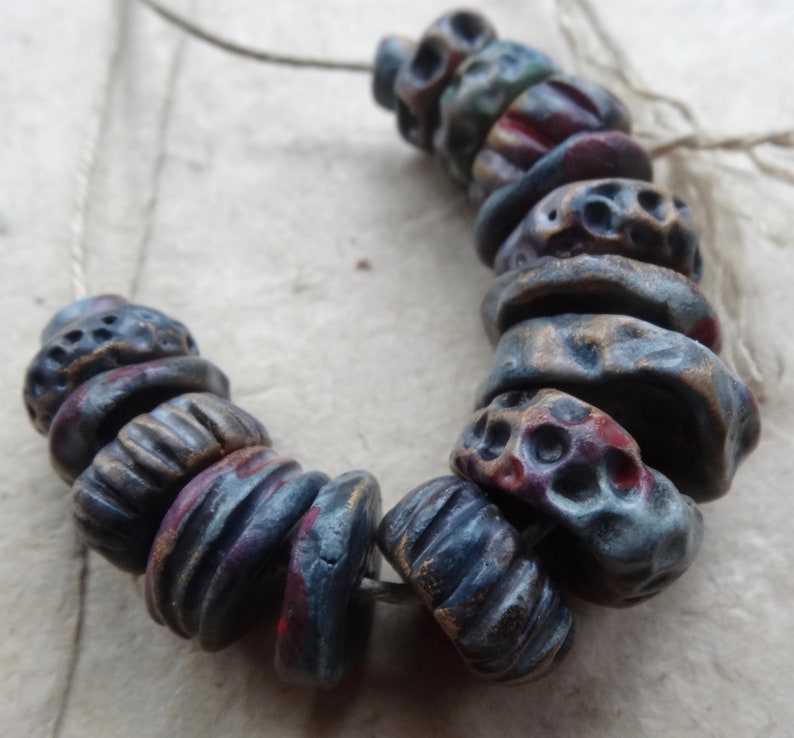early Summer dusk textured ceramic disc bead set purple red blue red gold katy wroe K44