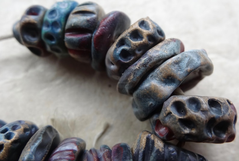 early Summer dusk textured ceramic disc bead set purple red blue red gold katy wroe K44