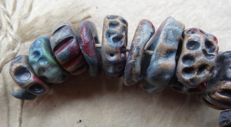 early Summer dusk textured ceramic disc bead set purple red blue red gold katy wroe K44