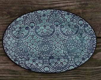 Beautiful, green, ceramic plate, with decorative texture