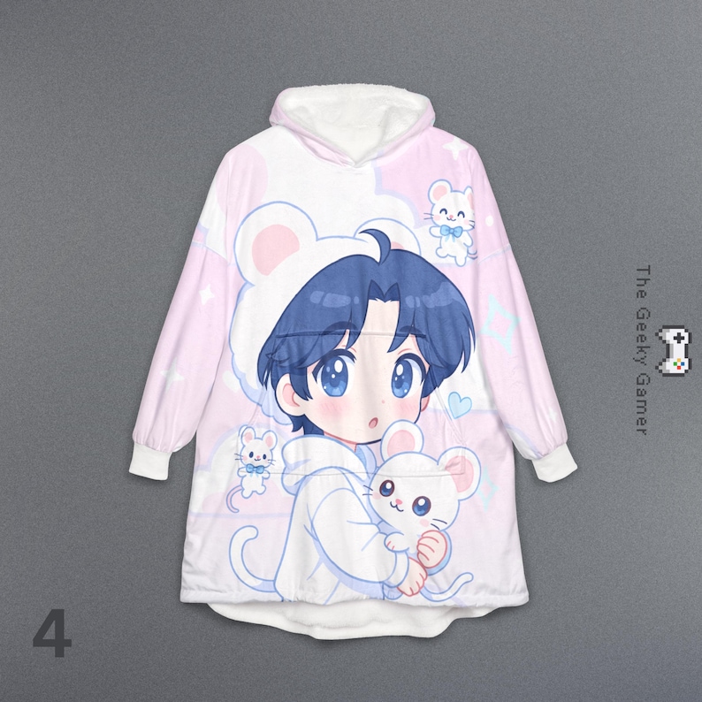 May include: A pink and white hooded blanket featuring an anime-style illustration of a character with blue hair and large blue eyes, wearing a mouse-eared hat and holding a white mouse. The blanket has a white fleece lining and the text "The Geeky Gamer".