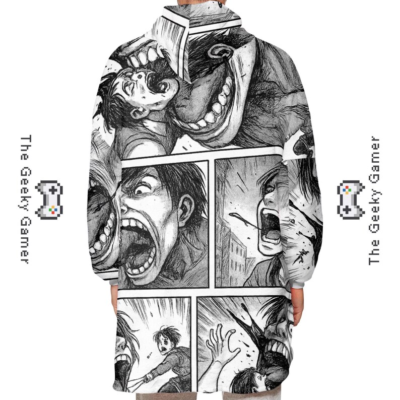 May include: A black and white hooded sweatshirt featuring a manga-style comic strip design. The artwork depicts intense facial expressions and action scenes. The Geeky Gamer logo is on the sides.