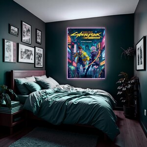 May include: A bedroom with a Cyberpunk: Edgerunners poster with a neon border above a bed with teal bedding. The poster shows two characters in a futuristic city. Other framed artwork is on the walls, creating a themed interior.