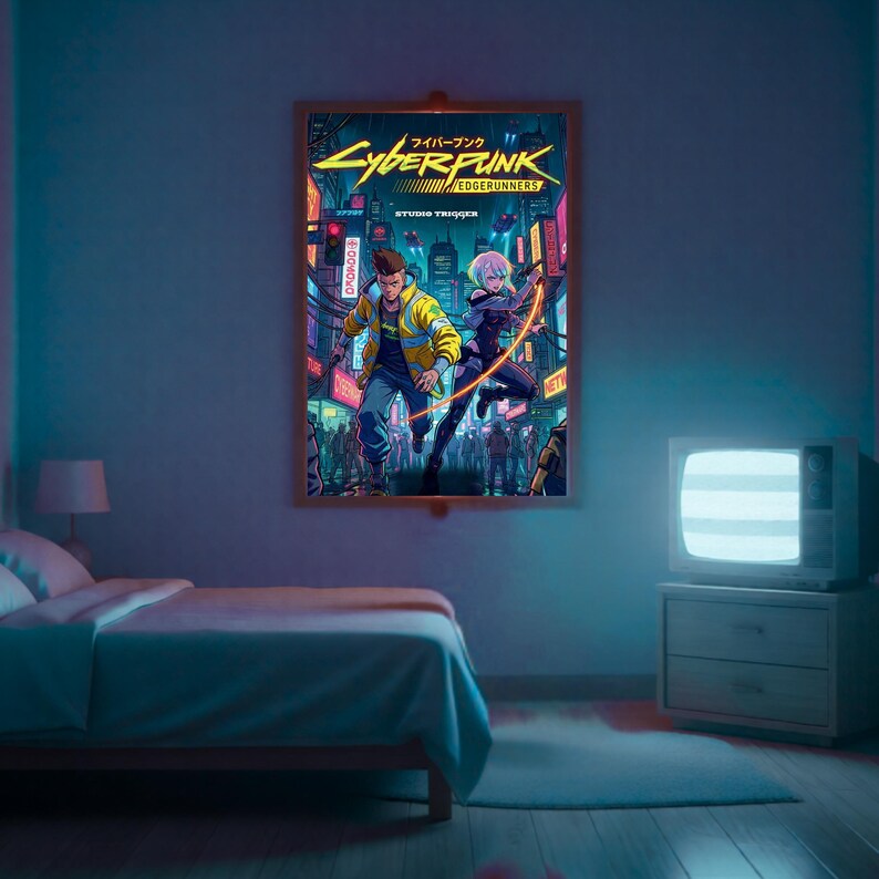 May include: A framed poster for Cyberpunk: Edgerunners, depicting two characters in a neon-lit cityscape. The artwork includes Japanese text. The poster is displayed on a blue wall above a bed in a room.