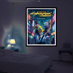 May include: A framed poster of the Cyberpunk: Edgerunners anime. The artwork shows two characters in a futuristic city with neon signs. The poster has a black frame and is displayed in a bedroom.