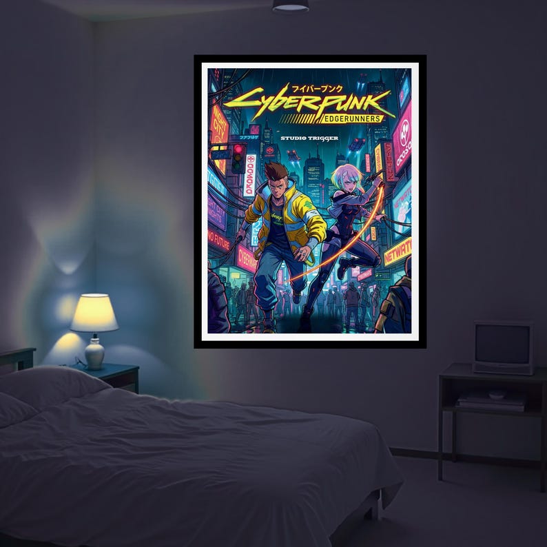 May include: A framed poster of the Cyberpunk: Edgerunners anime. The artwork shows two characters in a futuristic city with neon signs. The poster has a black frame and is displayed in a bedroom.