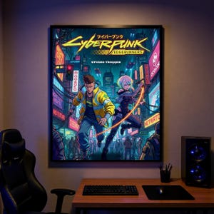 May include: A framed poster for Cyberpunk: Edgerunners. The image shows two characters in a futuristic city with neon signs and Japanese text. The colour scheme includes yellow, blue, and purple.