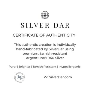 May include: A white certificate of authenticity from Silver Dar featuring a circular logo at the top. The text reads: SILVER DAR CERTIFICATE OF AUTHENTICITY. This authentic creation is individually hand-fabricated by SilverDar using premium, tarnish-resistant Argentium 940 Silver. Purer | Brighter | Tarnish Resistant | Hypoallergenic. Includes a Made in Argentium Silver logo and the website W: SilverDar.com.